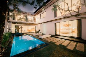a swimming pool in the backyard of a house at Seminyak vila luxury 4Br near beach LAfavela in Seminyak