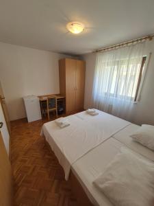 Katil atau katil-katil dalam bilik di Apartments and Rooms Mamić