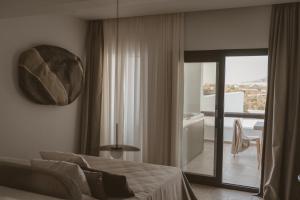 Posteľ alebo postele v izbe v ubytovaní Kalea Luxury Villas