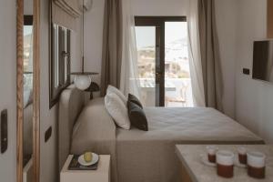 Posteľ alebo postele v izbe v ubytovaní Kalea Luxury Villas