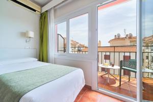Postel nebo postele na pokoji v ubytování Hostal Sol y Miel