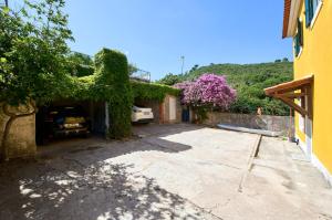 a house with a car parked in a driveway at Beach & Nature Villa with Amazing Pool by TimeCooler in Setúbal