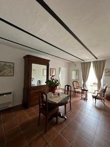a living room with a table and chairs at Resort Nuvola Srls in Ripabottoni