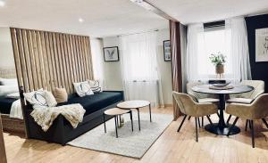 a living room with a couch and a table at 1 - 4 Pers Apartment Jeßnitz, Mawoi Living in Jeßnitz