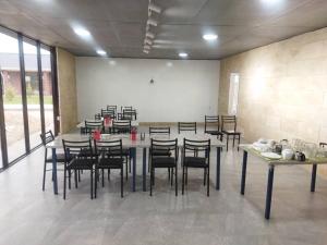 a large room with a table and chairs in it at Шатман in Chyrpykty