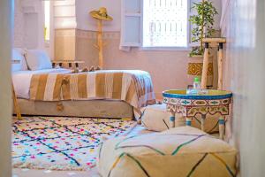 Postel nebo postele na pokoji v ubytování Riad Zayn & Spa