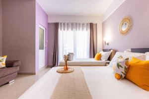 Postel nebo postele na pokoji v ubytování Potam'Sea Bliss 5 - Beach Front, Sun Beds & Parking + 21 fotografií