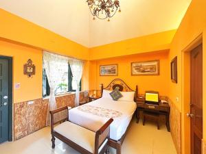 Postel nebo postele na pokoji v ubytování Ho Feng Private Hotel 電梯自助民宿