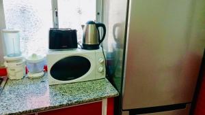 Kuchyň nebo kuchyňský kout v ubytování Appartement Charmant