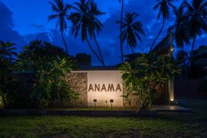 a building with the amana sign at night at Anama by Queens Mount in Tangalle