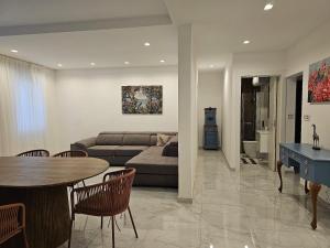 a living room with a couch and a table at Modern Elegance Valletta Apartment V1 in Valletta