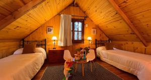 a room with three beds in a attic at Fratelli Cabañas-Apart in Rosario +59 photos