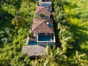 an aerial view of a resort with palm trees at Anama by Queens Mount in Tangalle