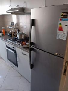a stainless steel refrigerator in a kitchen at Hay mohamady islane in Agadir