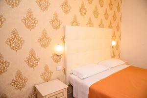 Postel nebo postele na pokoji v ubytování Hotel Ariston Riccione
