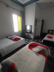 Postelja oz. postelje v sobi nastanitve Hotel Biarritz