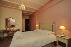 Postel nebo postele na pokoji v ubytování Thisoa Hotel