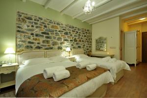 Giường trong phòng chung tại Thisoa Hotel