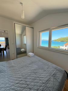 Postel nebo postele na pokoji v ubytování Sea View Apartments Zaboric
