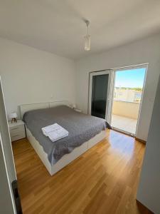 Postel nebo postele na pokoji v ubytování Sea View Apartments Zaboric