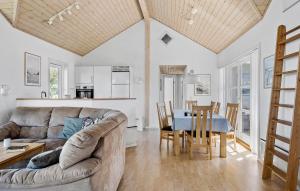 a living room with a couch and a table at Amazing Home In Nordborg With Wifi in Nordborg