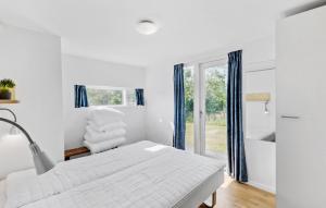 Postel nebo postele na pokoji v ubytování Holiday Home Kronvildtvej I