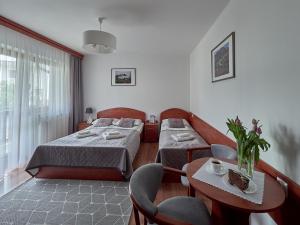 Postel nebo postele na pokoji v ubytování Willa Za Cieszynianką