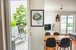 a living room with a table and a dining room at Traumwohnung im Kölner Süden in Hürth