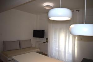 TV a/nebo společenská místnost v ubytování Jasmine Apartment