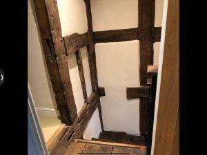 an overhead view of a wooden door in a room at The Medlar in Kington