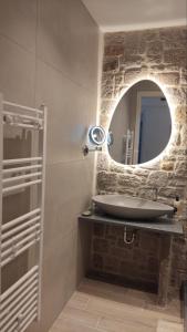 a bathroom with a sink and a mirror at Gea luxury apartment Myrina 1 in Myrina +28 photos
