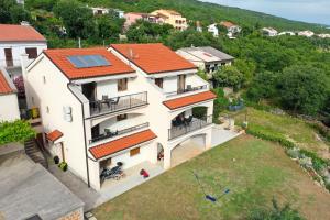 an aerial view of a house with a solar roof at Apartments Via Sole Dramalj in Dramalj