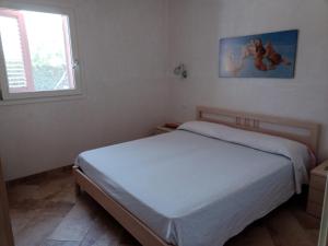 Postel nebo postele na pokoji v ubytování Villetta Palicelli