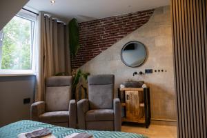 Posezení v ubytování Zeeschelp - Comfortabele kamer bij B&B Gezond aan Zee - Toegang Wellnesstuin meerprijs