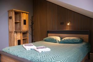 Postel nebo postele na pokoji v ubytování Zeeschelp - Comfortabele kamer bij B&B Gezond aan Zee - Toegang Wellnesstuin meerprijs + 15 fotografií