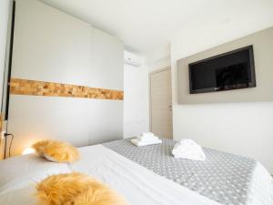 a bedroom with two dogs laying on a bed at Serenity with swimming pool and parking in Alassio in Alassio