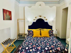 Postel nebo postele na pokoji v ubytování Sangiuliano Suite
