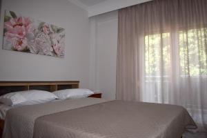Postel nebo postele na pokoji v ubytování Sunny Beach Front Apartment