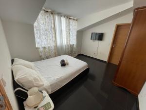 Postel nebo postele na pokoji v ubytování Chambre 3 Residencial Eunice