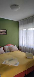 a bedroom with a bed with two towels on it at Crypto Hills Montenegro in Herceg-Novi +42 photos