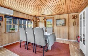 a dining room with a table and chairs at Awesome Home In Nyborg With Wifi in Nyborg +18 photos