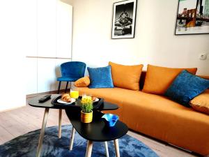 a living room with a couch and a table at Apartman Rijeka centar in Rijeka