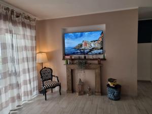 TV o dispositivi per l'intrattenimento presso Casa vacanze VesuviusView