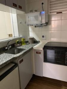 Kuchyň nebo kuchyňský kout v ubytování Flat mobiliado ap 44 - Ed Lhirondelle em Campinas