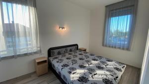 Posteľ alebo postele v izbe v ubytovaní Mifi Apartman Balatonlelle