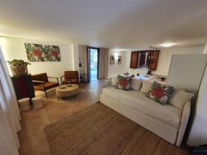a living room with a couch and a table at Villa Regina ai Faraglioni di Scopello in Scopello