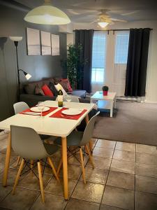 a dining table and chairs in a living room at Modern Dream at Fairmont in Fairmont Hot Springs