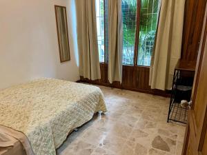 Ένα ή περισσότερα κρεβάτια σε δωμάτιο στο Carolina Hostel
