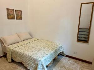 Ένα ή περισσότερα κρεβάτια σε δωμάτιο στο Carolina Hostel