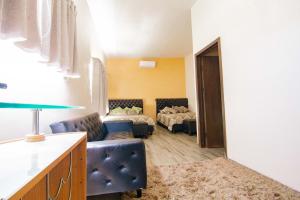 Postel nebo postele na pokoji v ubytování Quinta San Carlos Ensenada